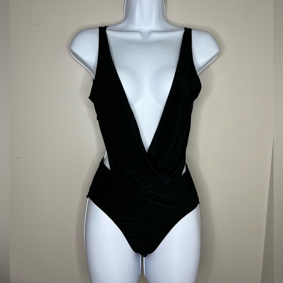 Charlotte Russe Tops - Charlotte Russe deep v neck halter bodysuit. Black. Small. Festival/night out!